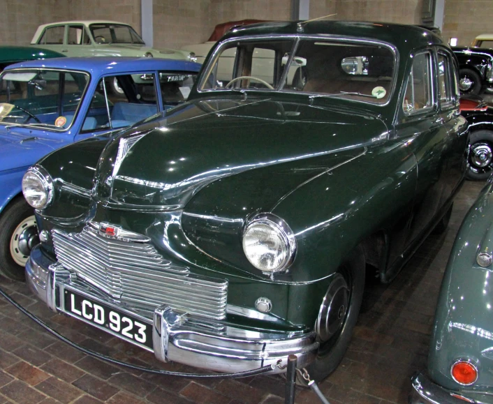 vintage car is shown on display at a museum