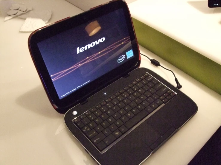 a close up of a laptop on top of a table