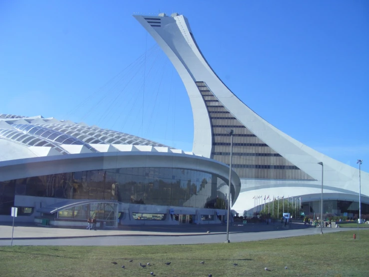 an unusual building that is standing in the grass