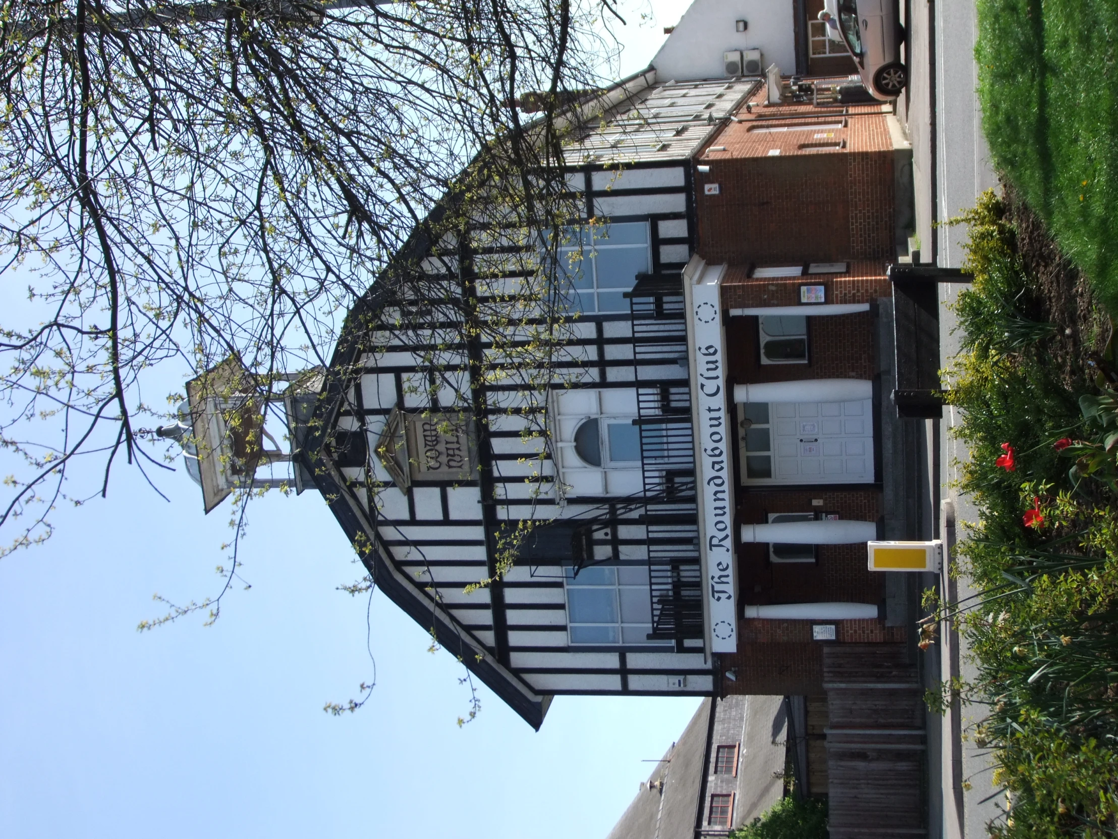 a church with tall buildings on the side