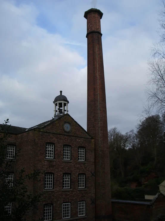 brick building with a steeple next to it