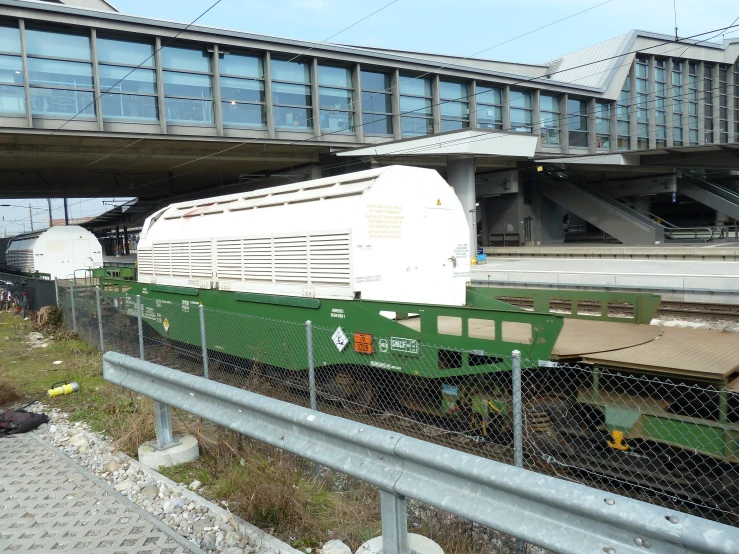 a train traveling down tracks near a building