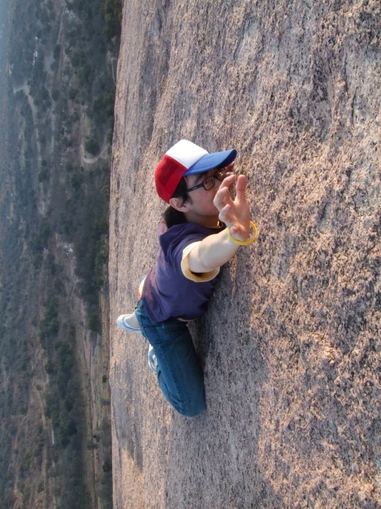 a little  that is standing up on some rocks