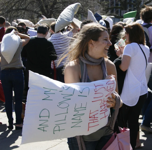 a person holding a sign that says i am happy birthday