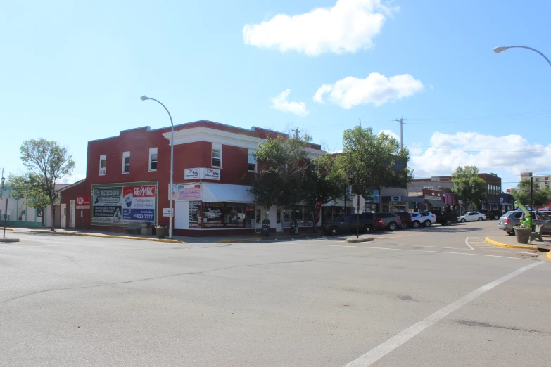 a red building that has many stores on the outside