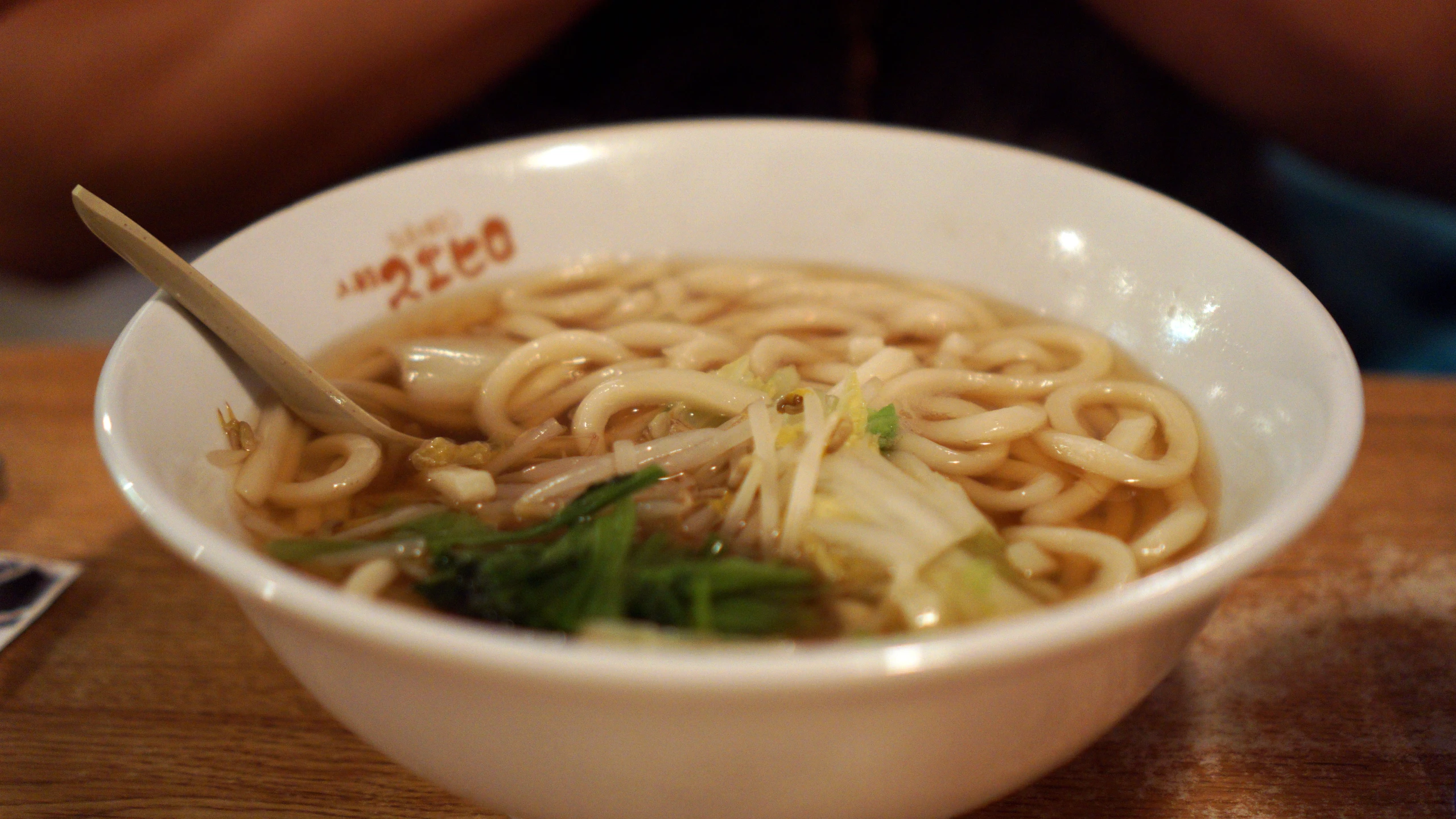 a bowl of ramen soup with a spoon in it