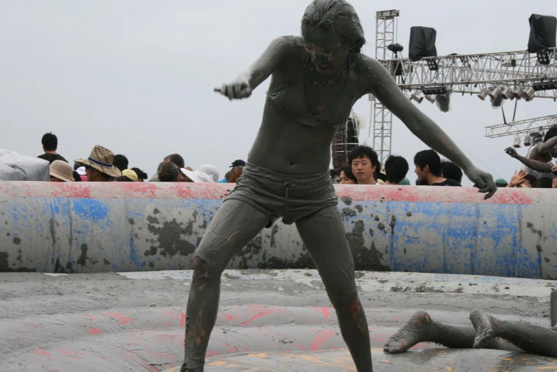 people play in the mud at the festival