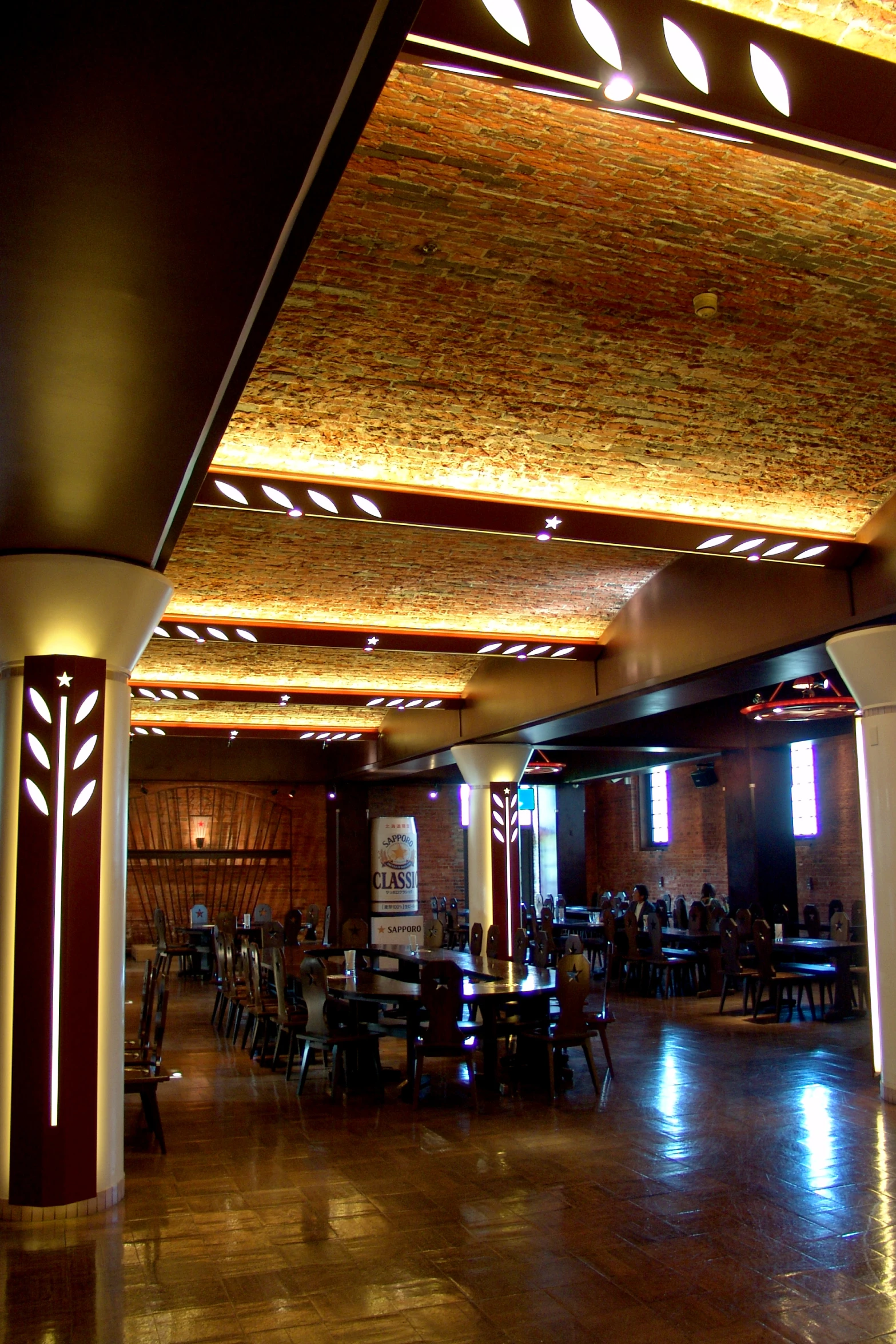 a dining hall with lots of chairs and table