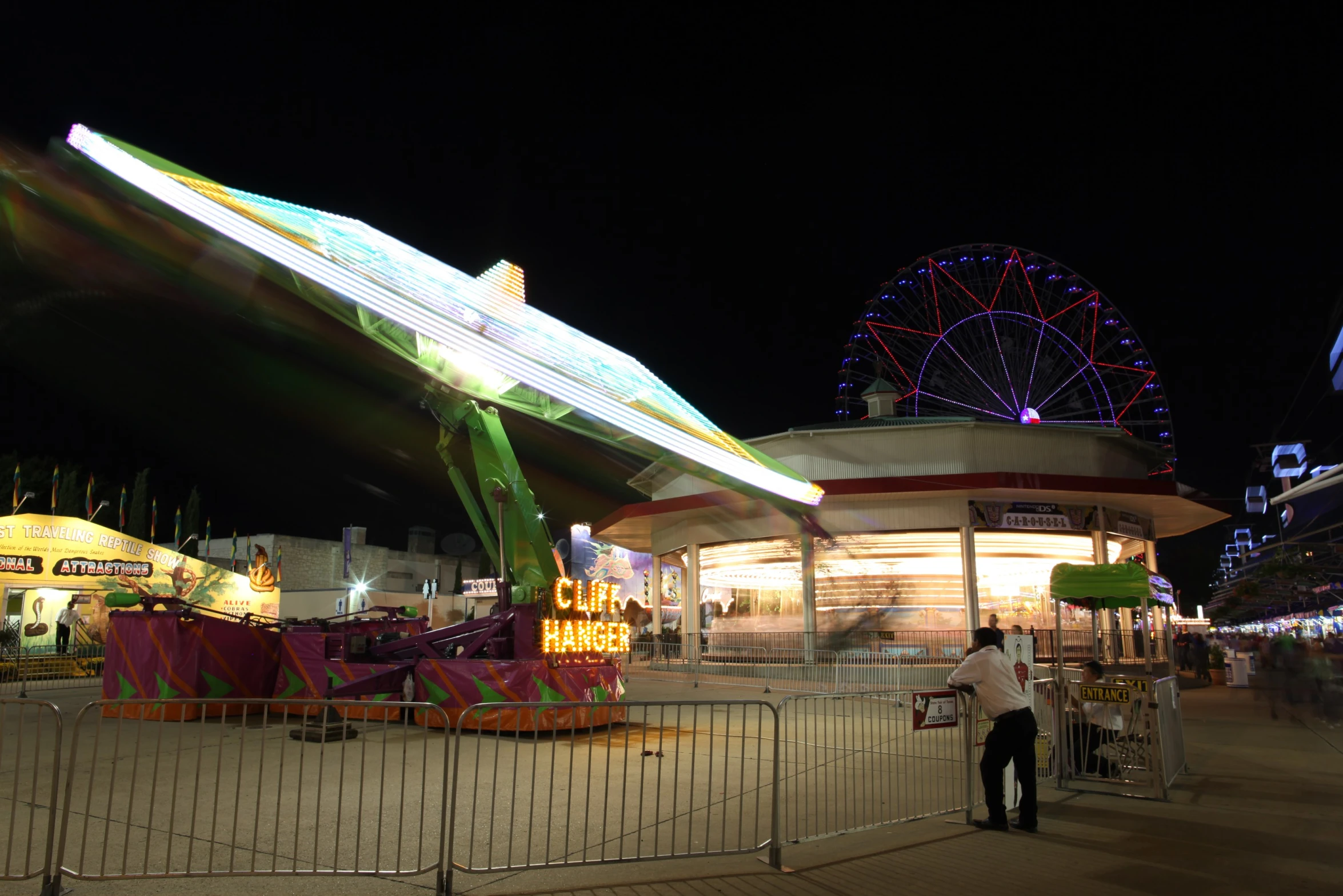 there is a carnival park with rides and rides