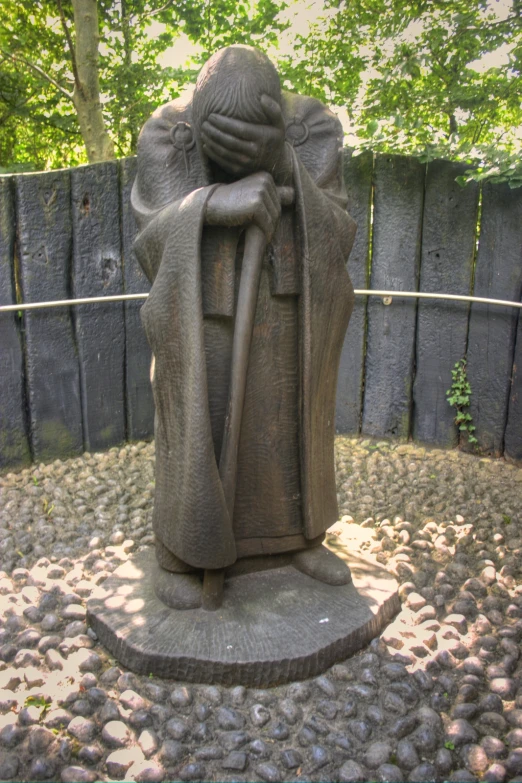a statue of a monk sitting in a circle