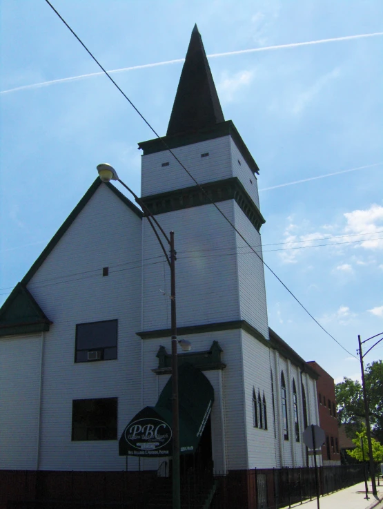 a church with a steeple in the front of it