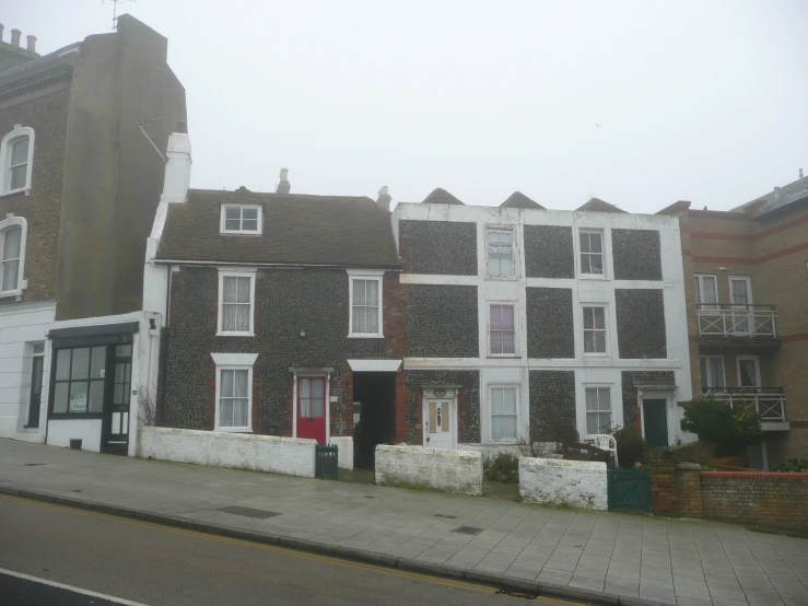 a group of houses on a city street