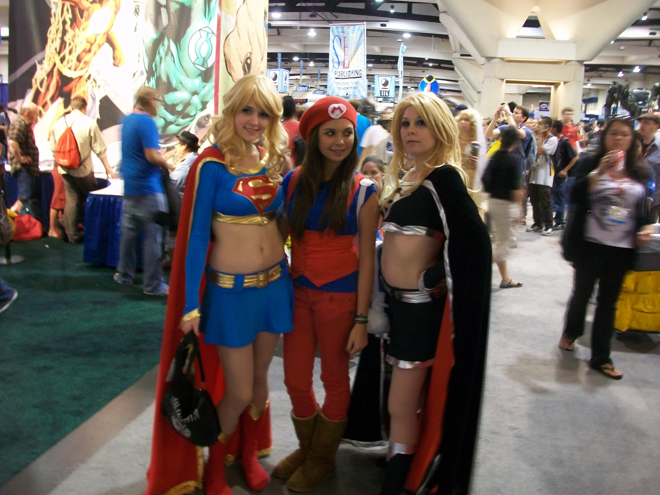 three women dressed up and posing at an event