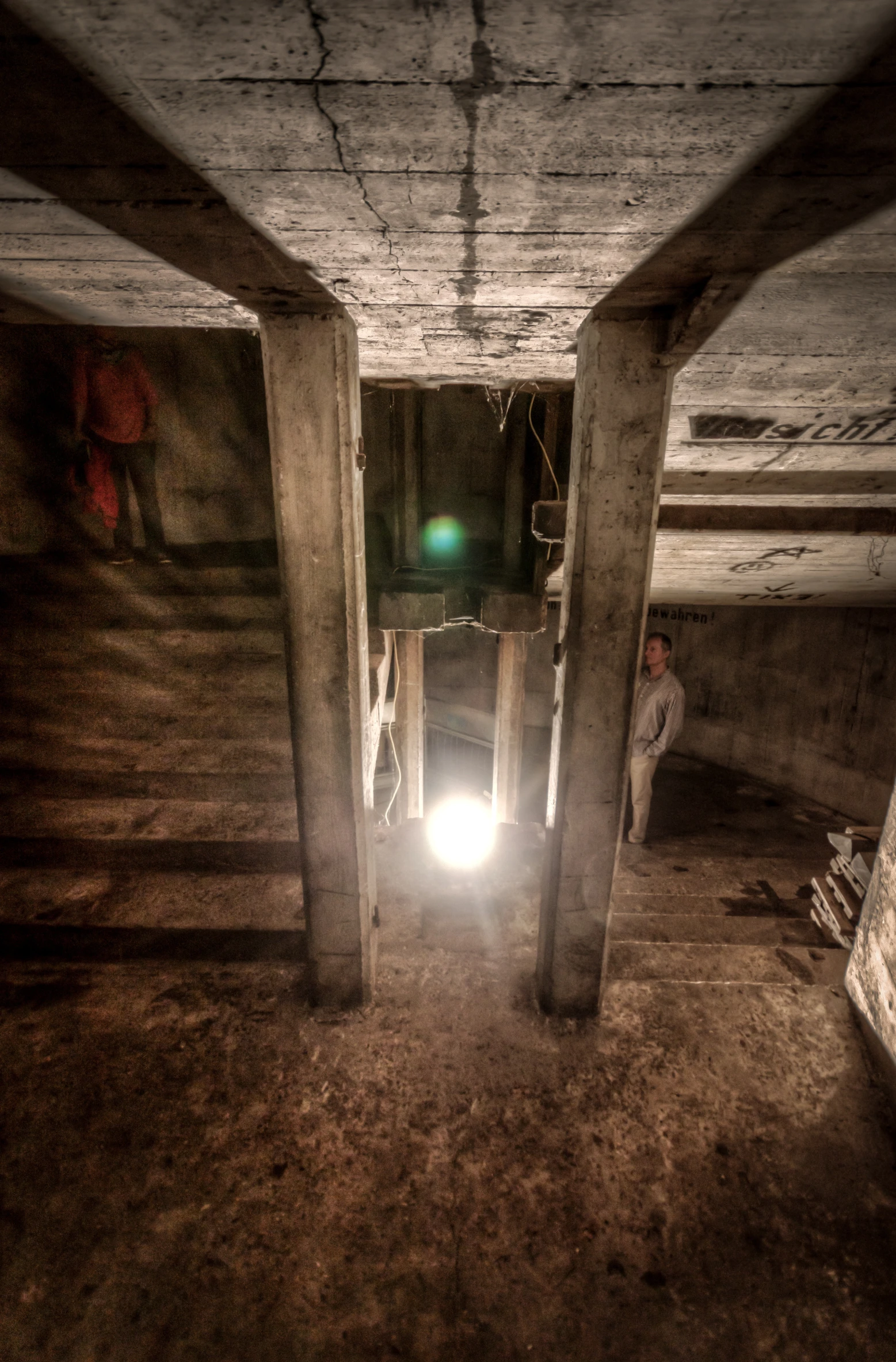 a man that is standing under a beam