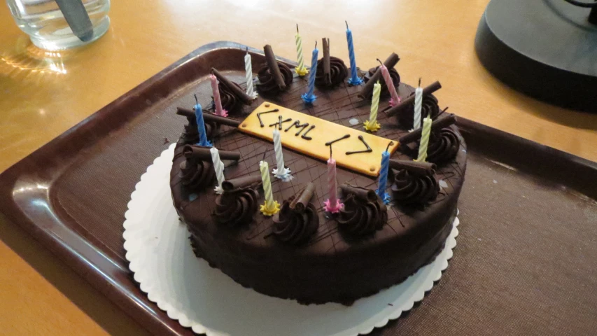 there is chocolate cake with candles that say exit