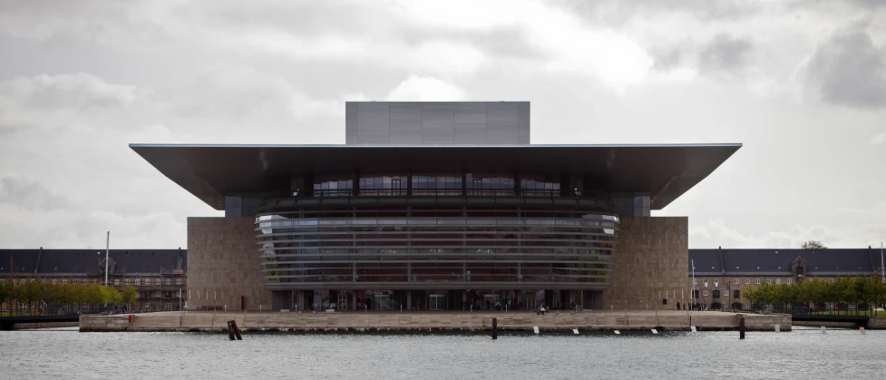 a large building on the side of a body of water