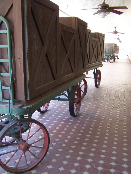 a wagon is parked in front of other wagons