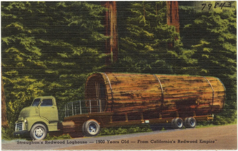 a wood truck passing behind a large wooden barrel