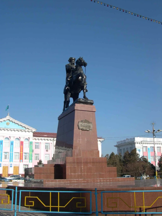 a monument of the three men sitting on top of it