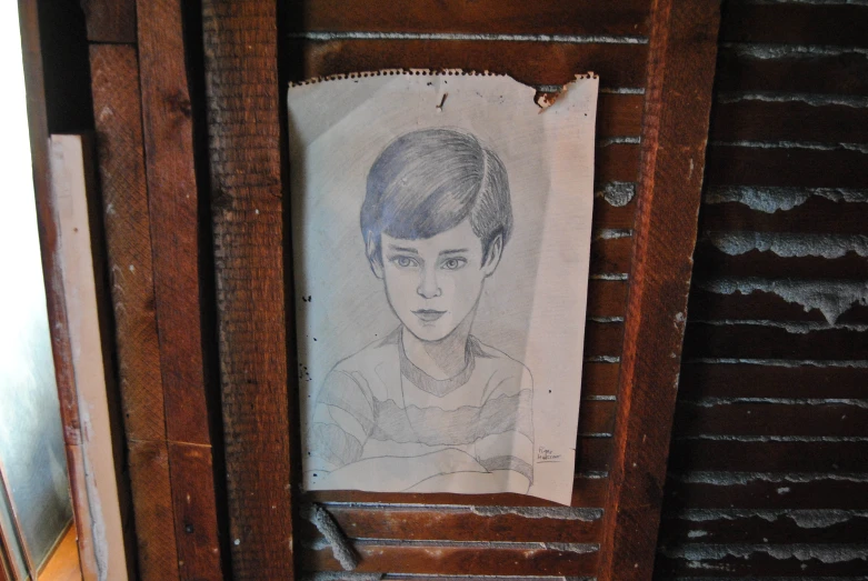 a drawing of a young man hanging in a door