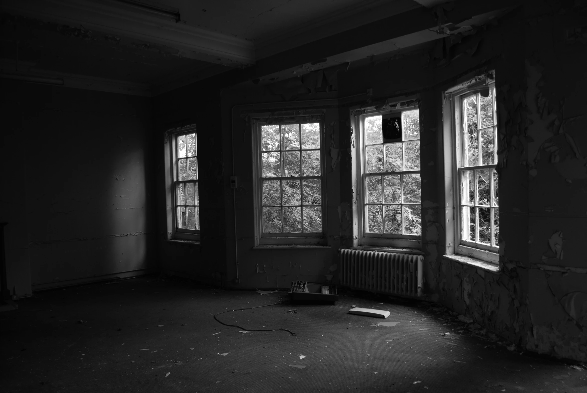 a room with broken windows and floor