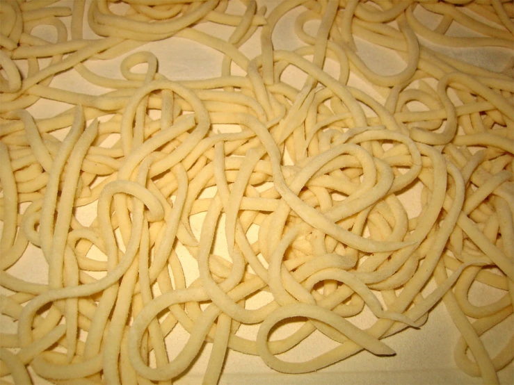 close up of noodles in a pan on table