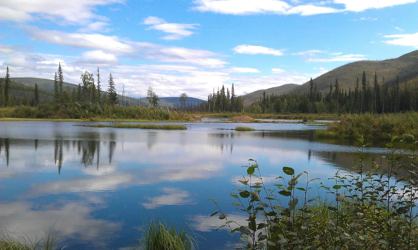 a lake in the middle of some mountains