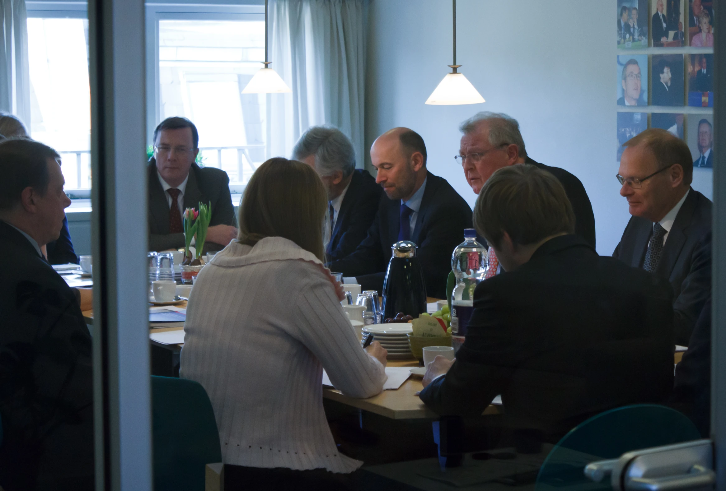 a group of people sitting around a table