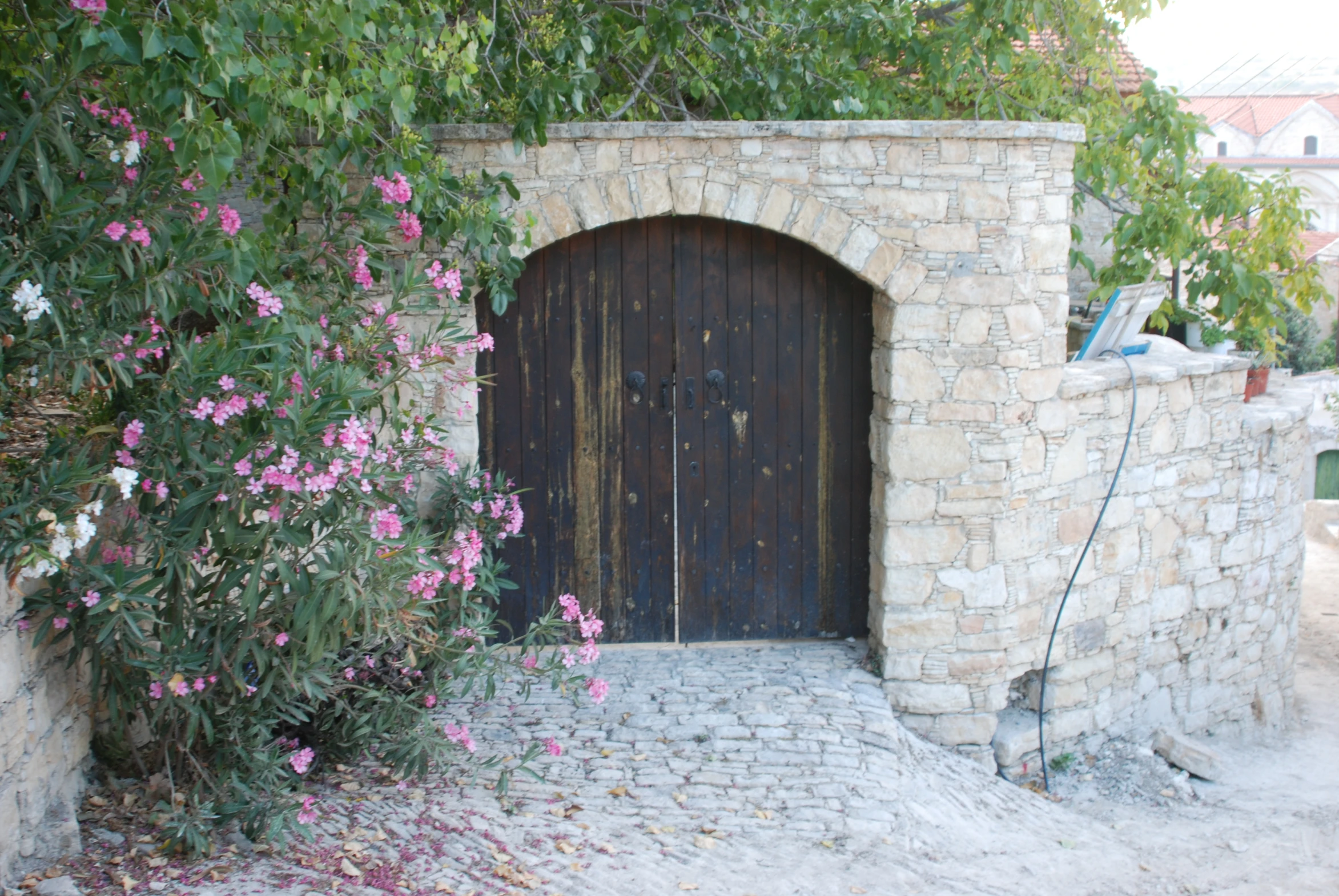 the door is closed on the building as it has flowers