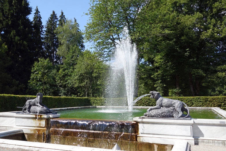 fountain with statue of elephants in a formal landscaped area