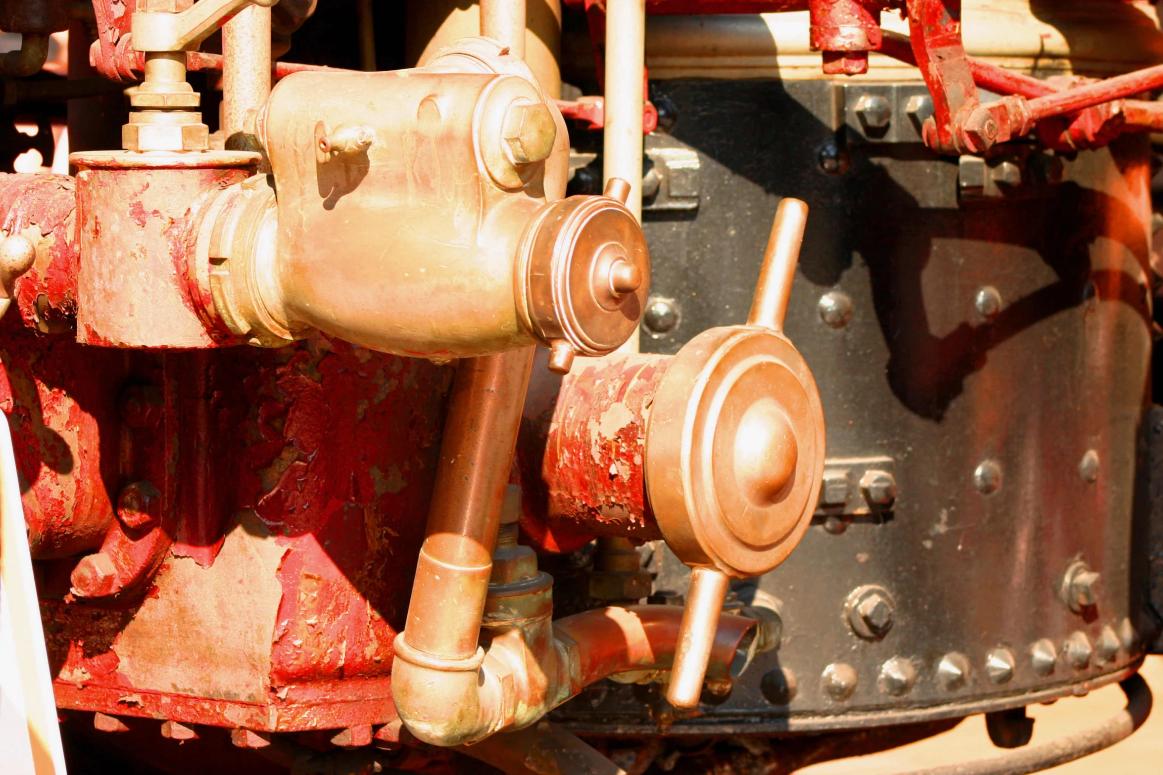 a red valve that is on the side of a building