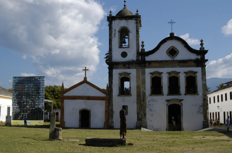 an old and ornate church with graveyard in the foreground