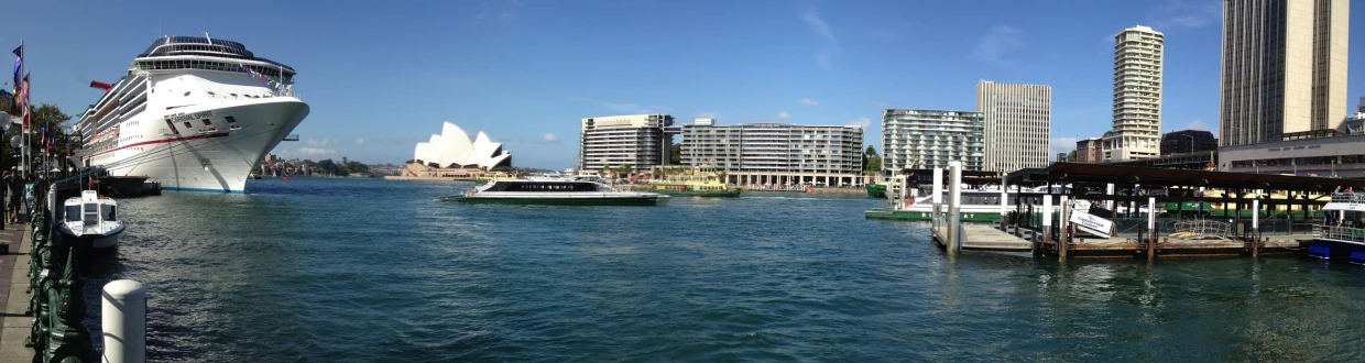 some boats in the water near large buildings