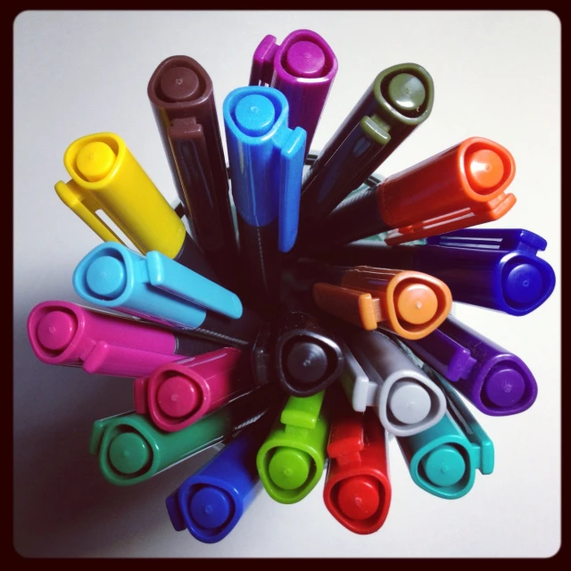 a group of markers that are sitting in a circle