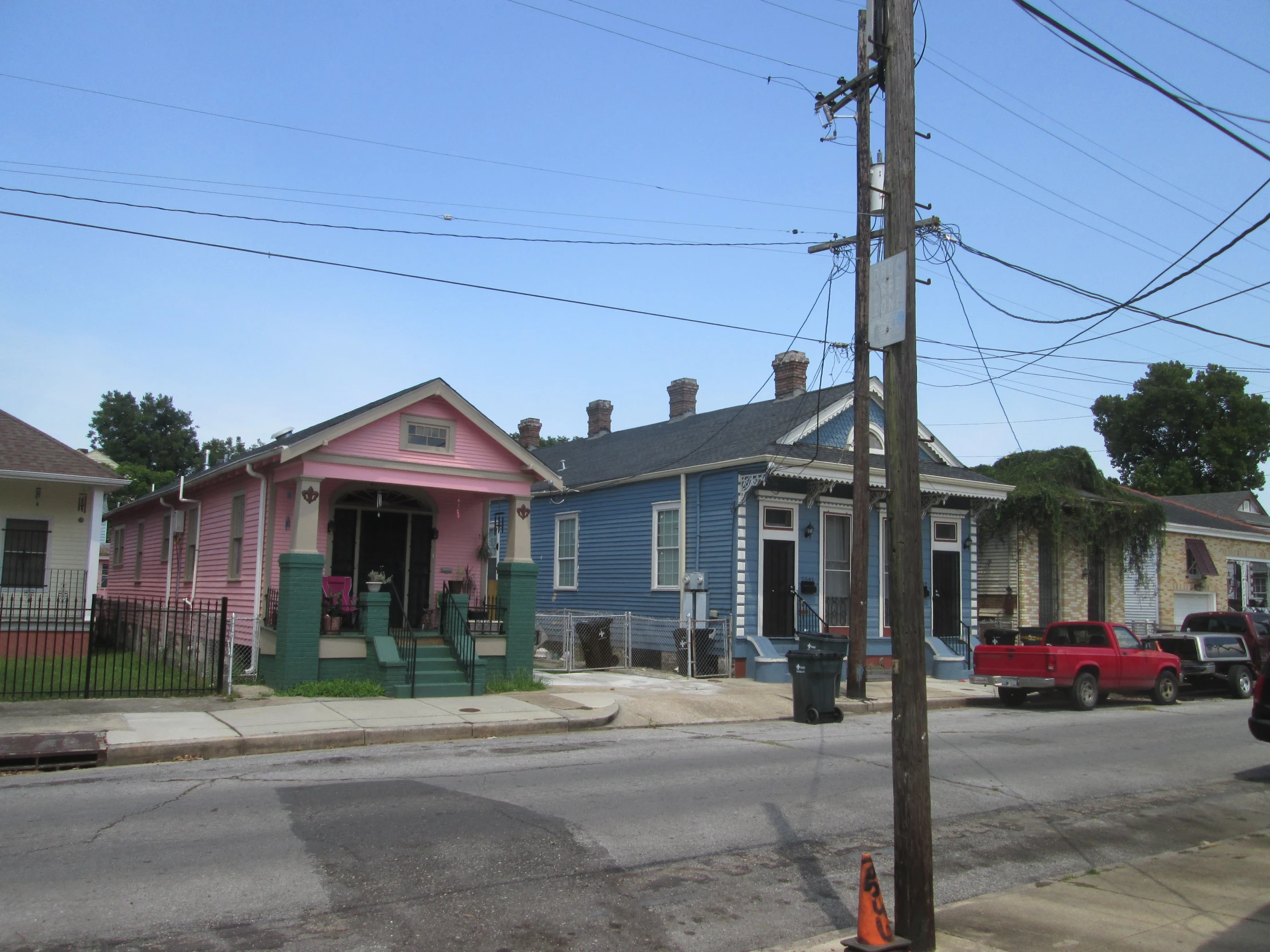 a street view of two colorful houses next to each other