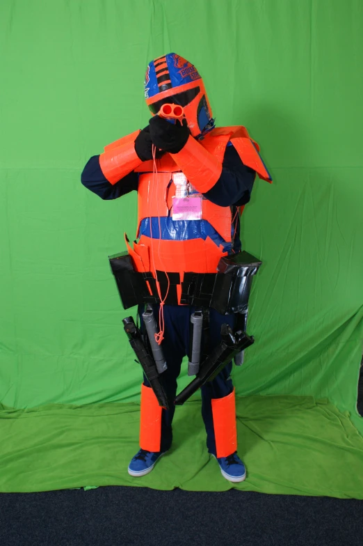 a man in a life jacket is holding up a camera