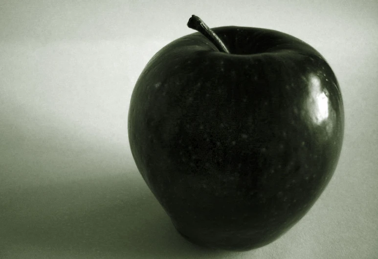 an apple on a plain white background, with the core in the middle