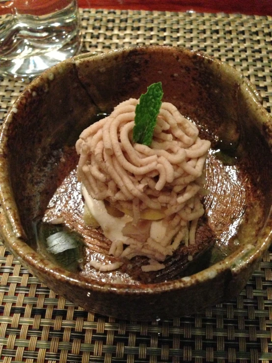 a close up of a bowl of food on a table