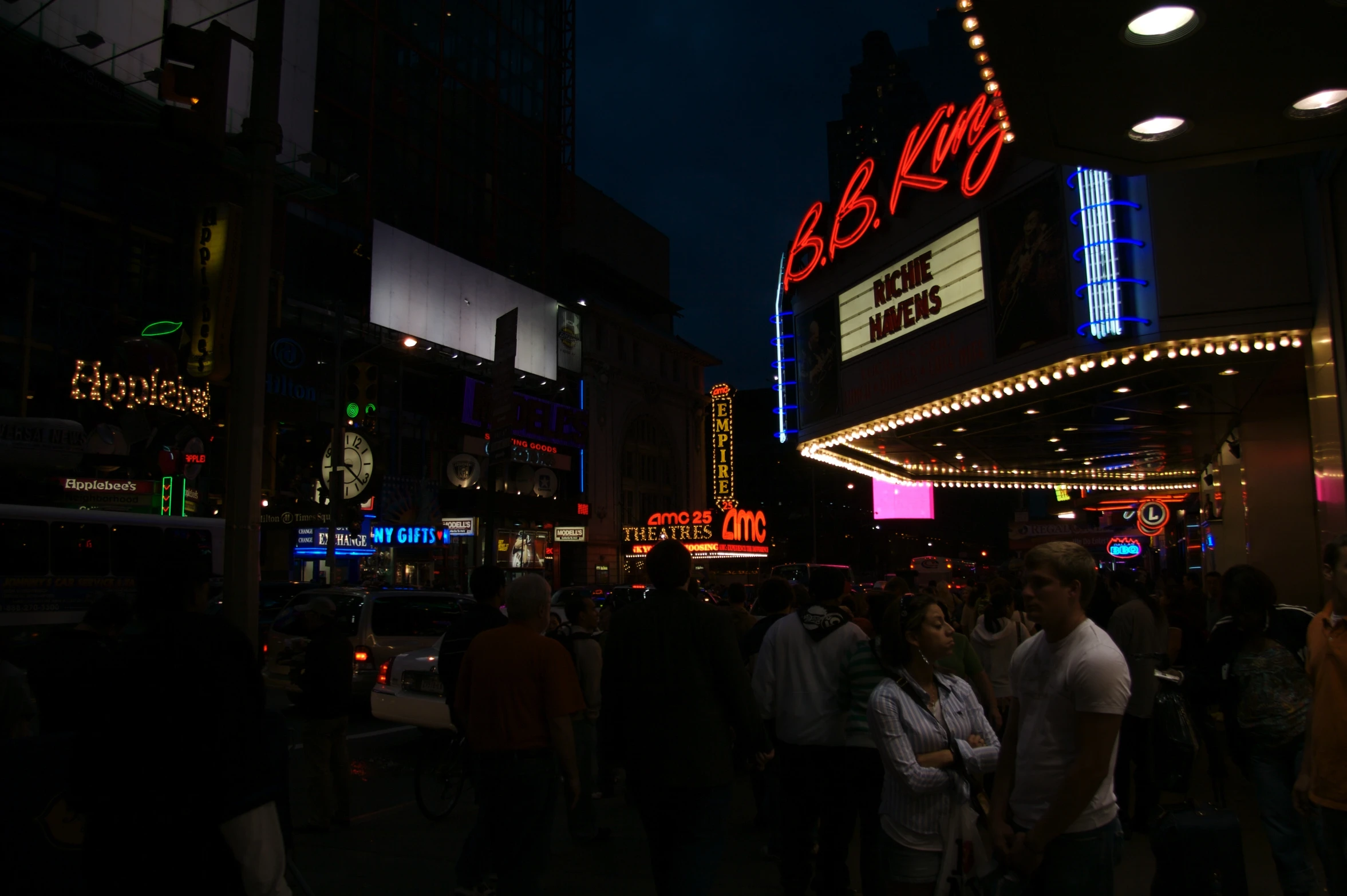 a group of people are walking on the street