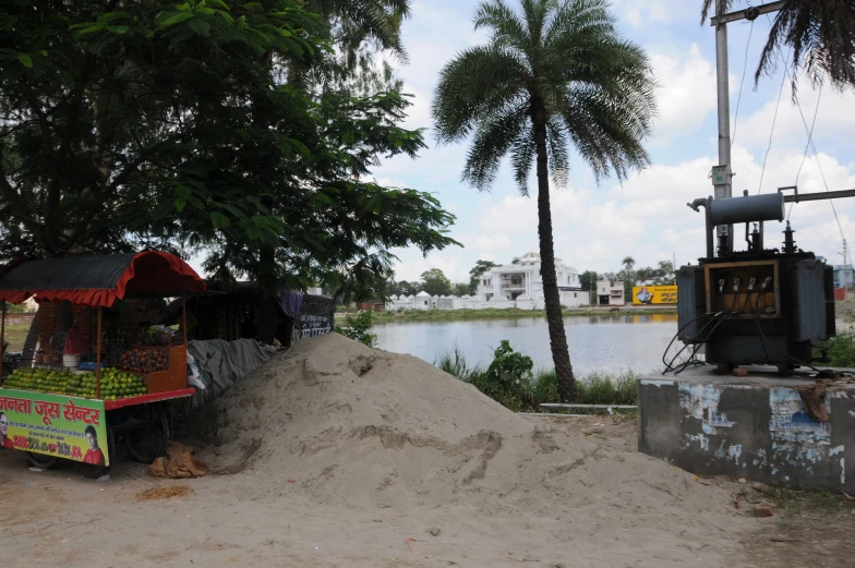 a bunch of sand near a river and some trees