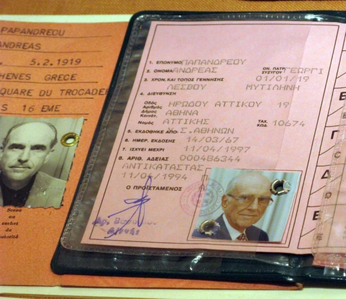 a passport is shown with pos from two men