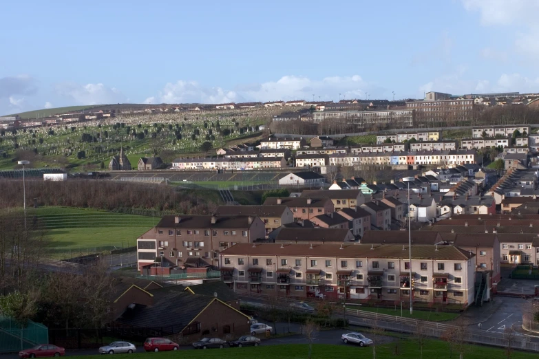 a city view of several buildings along side of a hill