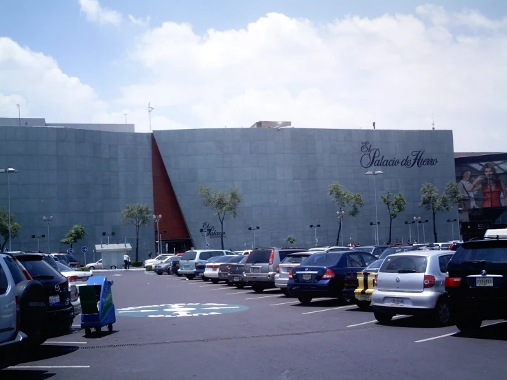 parking lot with a car dealership on the side