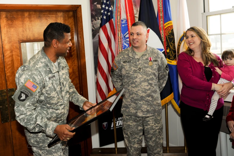 two men in uniform and an image of women