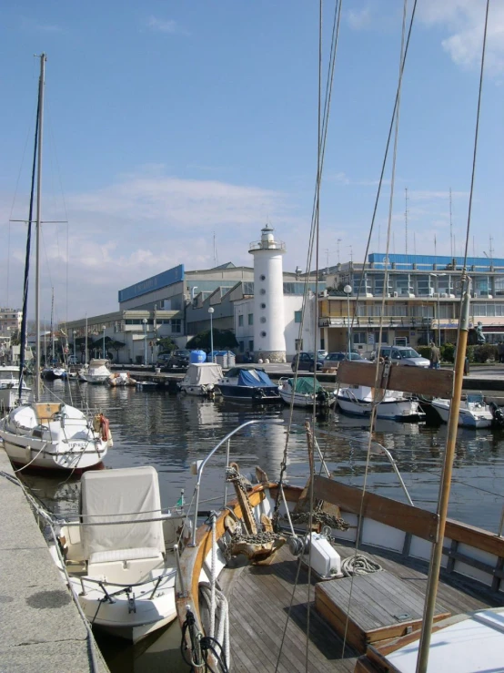 several small boats are parked at the dock