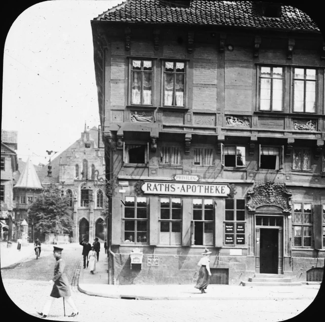 an old black and white po of people in front of a store