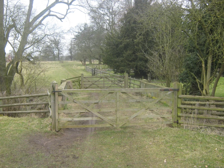 a wooden gate leads out to the fields