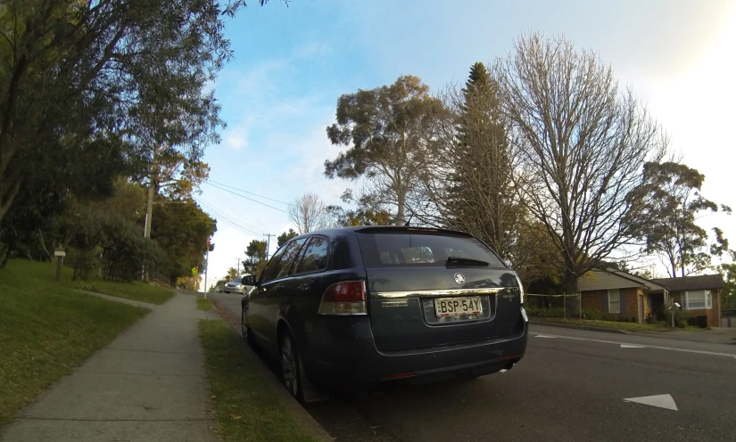 a black car parked on the side of a road