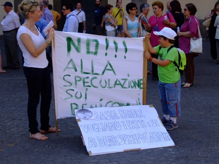 a woman pointing at a sign that says no 1 alla specialized district