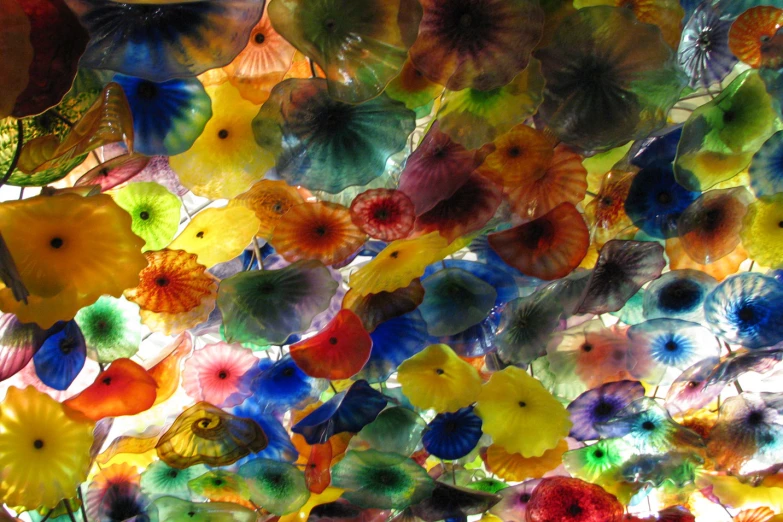 a ceiling full of multicolored plastic umbrellas